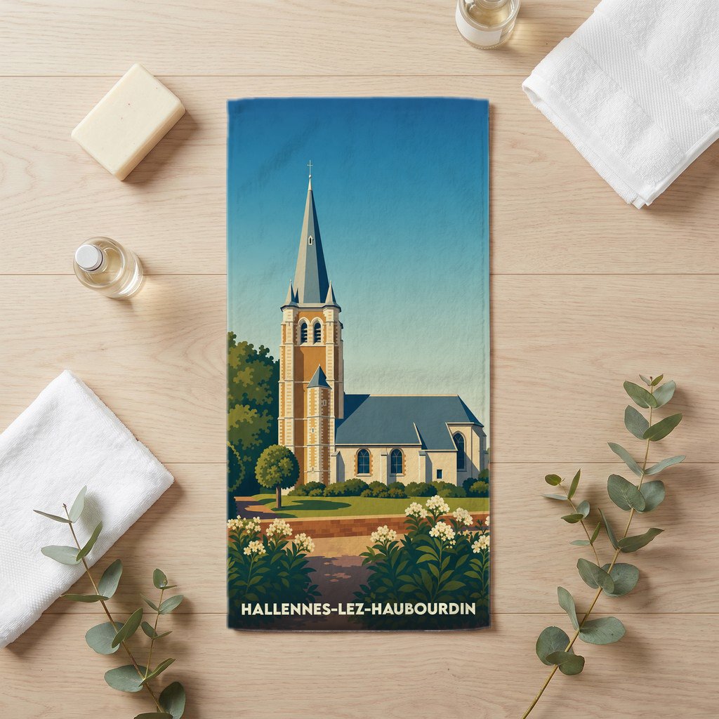 Serviette de bain souvenir de la ville de Hallennes-lez-Haubourdin avec une illustration stylisée de son église.