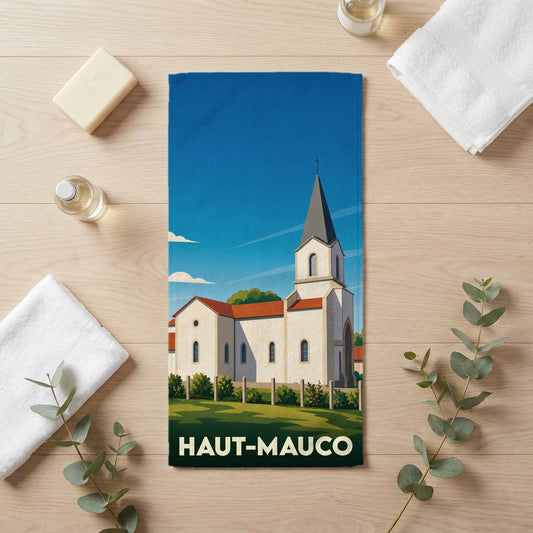 Serviette de bain souvenir de la ville de Haut-Mauco avec une illustration stylisée de son église.
