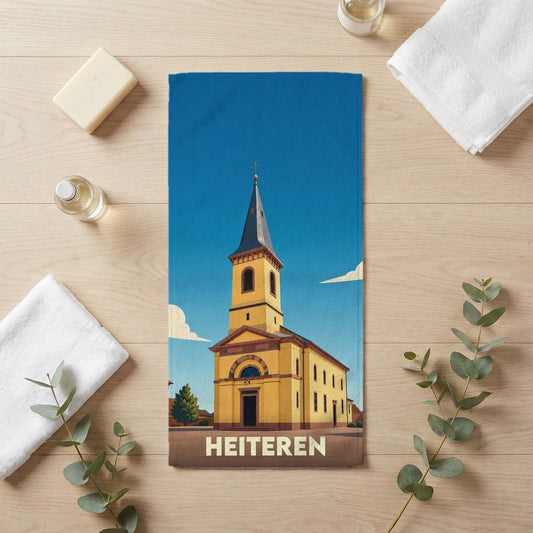 Serviette de bain souvenir de la ville de Heiteren avec une illustration stylisée de son église.