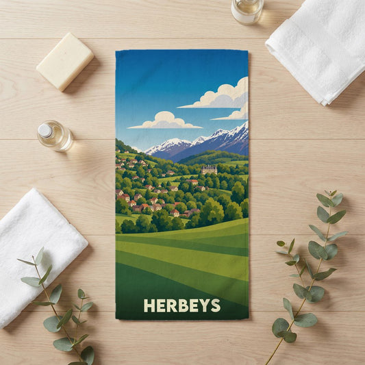 Serviette de bain souvenir de la ville de Herbeys avec une illustration de paysage montagneux.