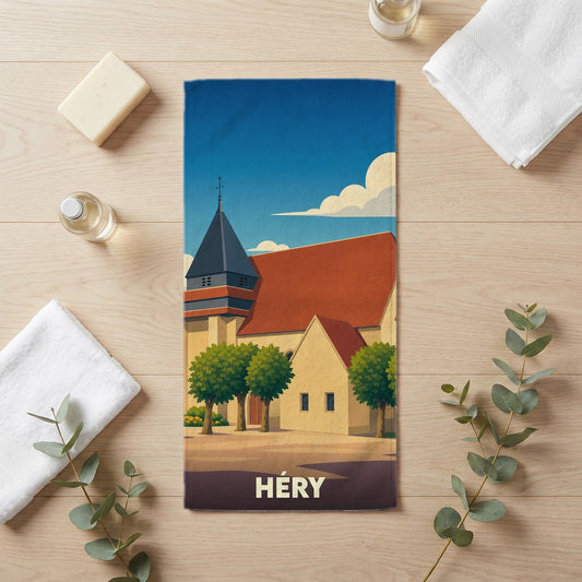 Serviette de bain souvenir de la ville de Héry avec une illustration stylisée de son église.