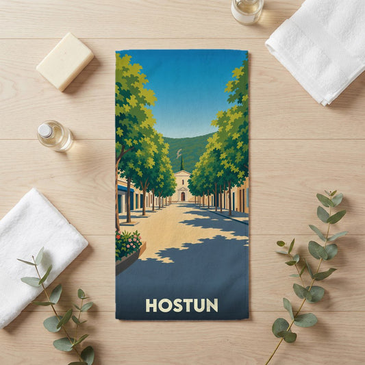 Serviette de bain souvenir de la ville de Hostun avec une illustration stylisée.
