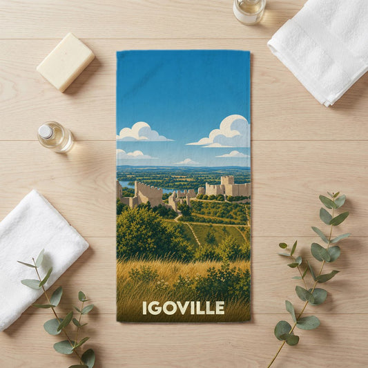 Serviette de bain souvenir de la ville d'Igoville avec une illustration stylisée de son paysage et de ses ruines.