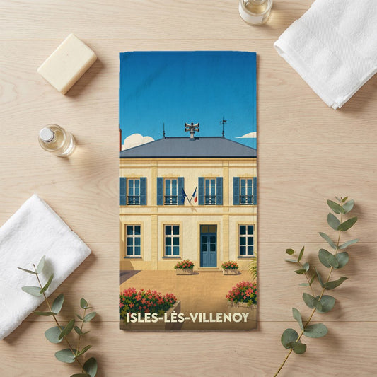 Serviette de bain souvenir de la ville de Isles-lès-Villenoy avec une illustration stylisée de sa mairie.