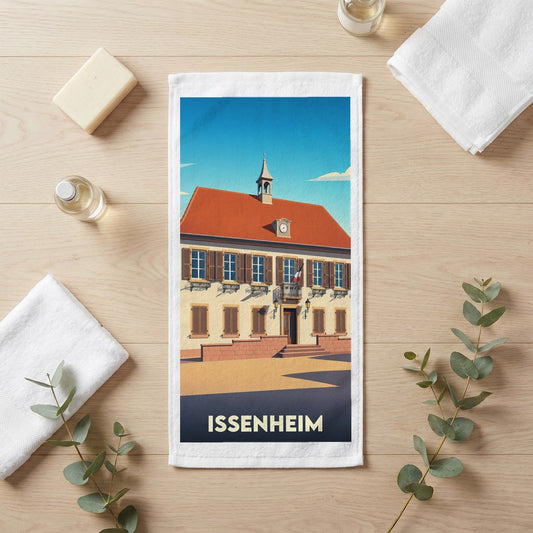 Serviette de bain souvenir de la ville d'Issenheim avec une illustration stylisée d'un bâtiment historique.