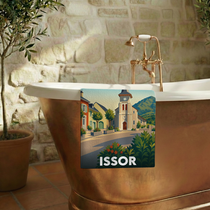 Serviette de bain souvenir de la ville d'Issor avec une illustration stylisée du village.