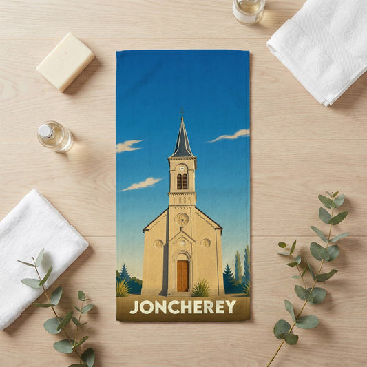 Serviette de bain souvenir de la ville de Joncherey illustrée d'une église sous un ciel bleu.