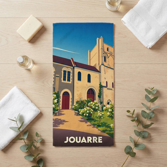 Serviette de bain souvenir de la ville de Jouarre avec une illustration stylisée d'une abbaye.