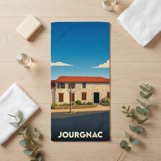 Serviette de bain souvenir de la ville de Jourgnac avec une illustration stylisée d'une maison traditionnelle.