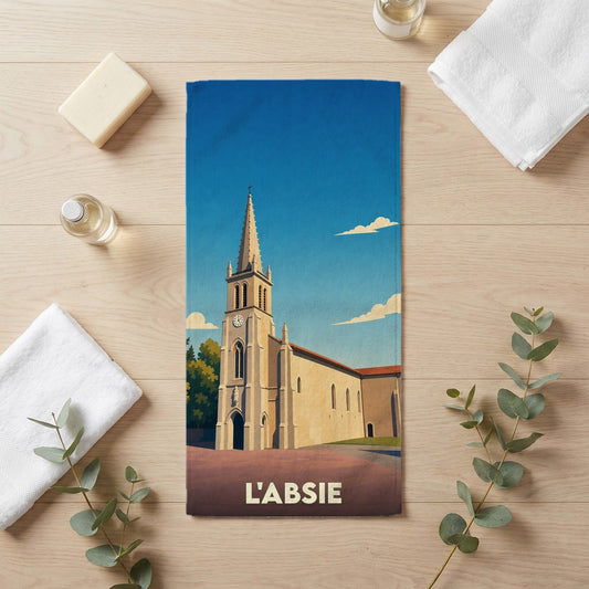 Serviette de bain souvenir de la ville de L'Absie illustrée d'une église de style rétro.