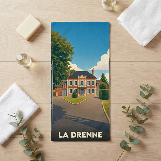 Serviette de bain souvenir de la ville de La Drenne avec une illustration stylisée d'une demeure bourgeoise.