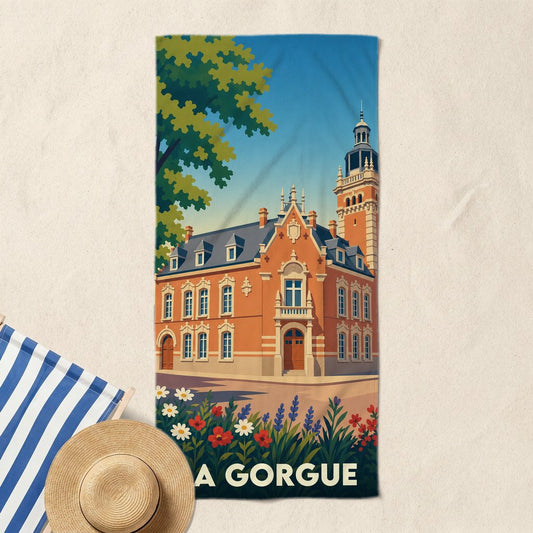 Serviette de bain souvenir de la ville de La Gorgue illustrée d'un bâtiment historique de style flamand.