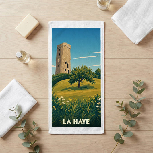 Serviette de bain souvenir de la ville de La Haye avec une illustration stylisée d'une tour médiévale.