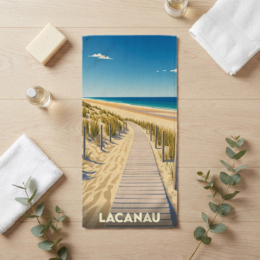 Serviette de bain souvenir de la ville de Lacanau avec une illustration stylisée d'un chemin de plage.