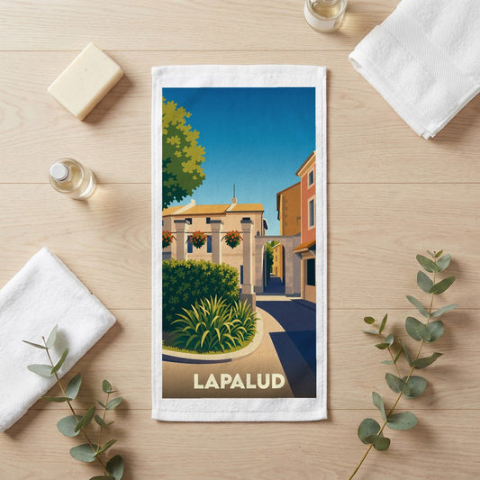Serviette de bain souvenir de la ville de Lapalud avec une illustration stylisée.