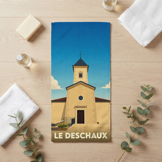 Serviette de bain souvenir de la ville de Le Deschaux avec une illustration stylisée de son église.