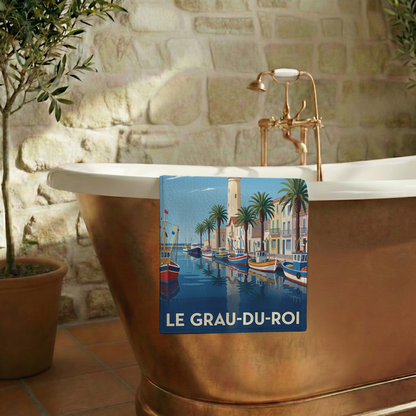 Serviette de bain souvenir de la ville de Le Grau-du-Roi avec une illustration stylisée.