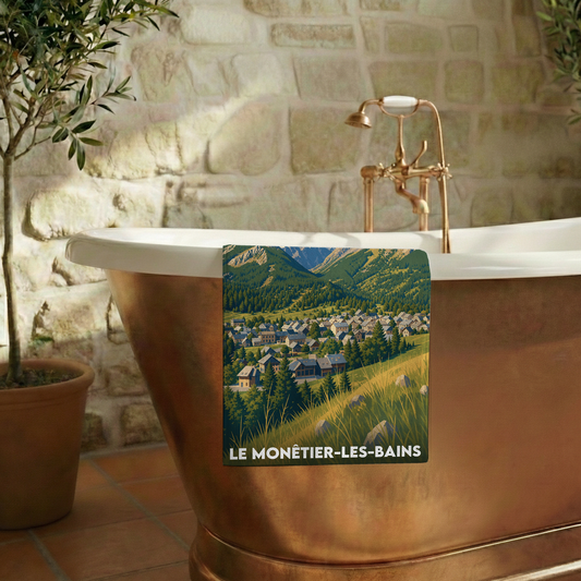 Serviette de bain souvenir de la ville de Le Monêtier-les-Bains avec une illustration stylisée de village de montagne.