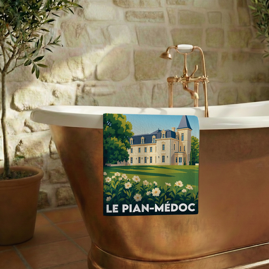 Serviette de bain souvenir de la ville de Le Pian-Médoc avec une illustration stylisée d'un château.