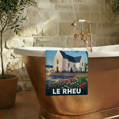 Serviette de bain souvenir de la ville de Le Rheu avec une illustration stylisée.