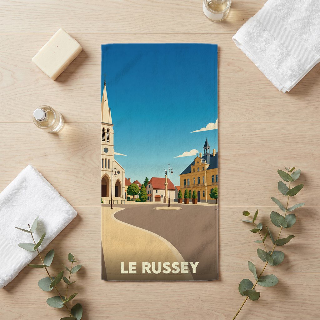 Serviette de bain souvenir de la ville de Le Russey avec une illustration stylisée.