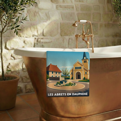 Serviette de bain souvenir de la ville de Les Abrets en Dauphiné avec une illustration stylisée.