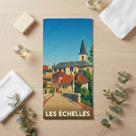 Serviette de bain souvenir de la ville de Les Échelles avec une illustration stylisée d'un paysage urbain.