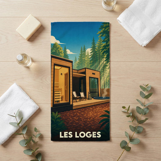 Serviette de bain souvenir de la ville de Les Loges avec une illustration stylisée d'un chalet moderne en forêt.