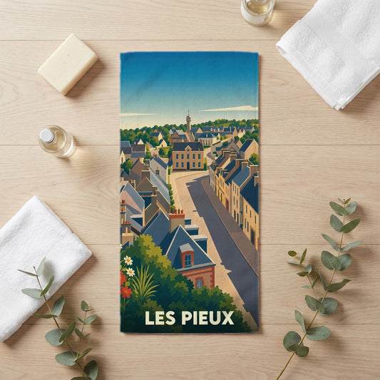 Serviette de bain souvenir de la ville de Les Pieux avec une illustration stylisée.