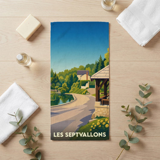 Serviette de bain souvenir de la ville de Les Septvallons avec une illustration stylisée.