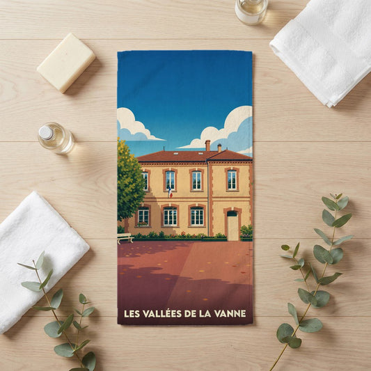 Serviette de bain souvenir de la ville de Les Vallées de la Vanne avec une illustration stylisée.