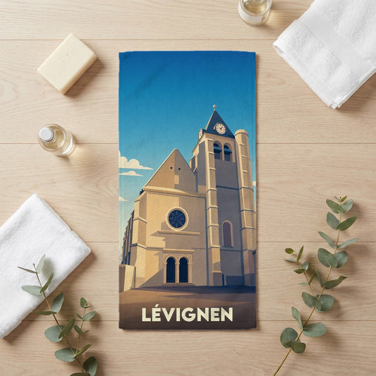 Serviette de bain souvenir de la ville de Lévignen avec une illustration stylisée de son église.