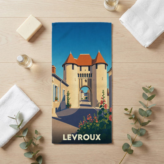 Serviette de bain souvenir de la ville de Levroux avec une illustration stylisée de sa porte médiévale.