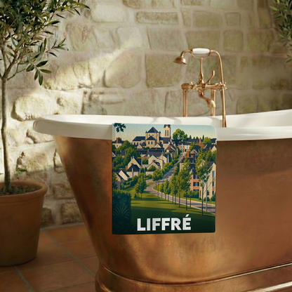 Serviette de bain souvenir de la ville de Liffré avec une illustration stylisée.