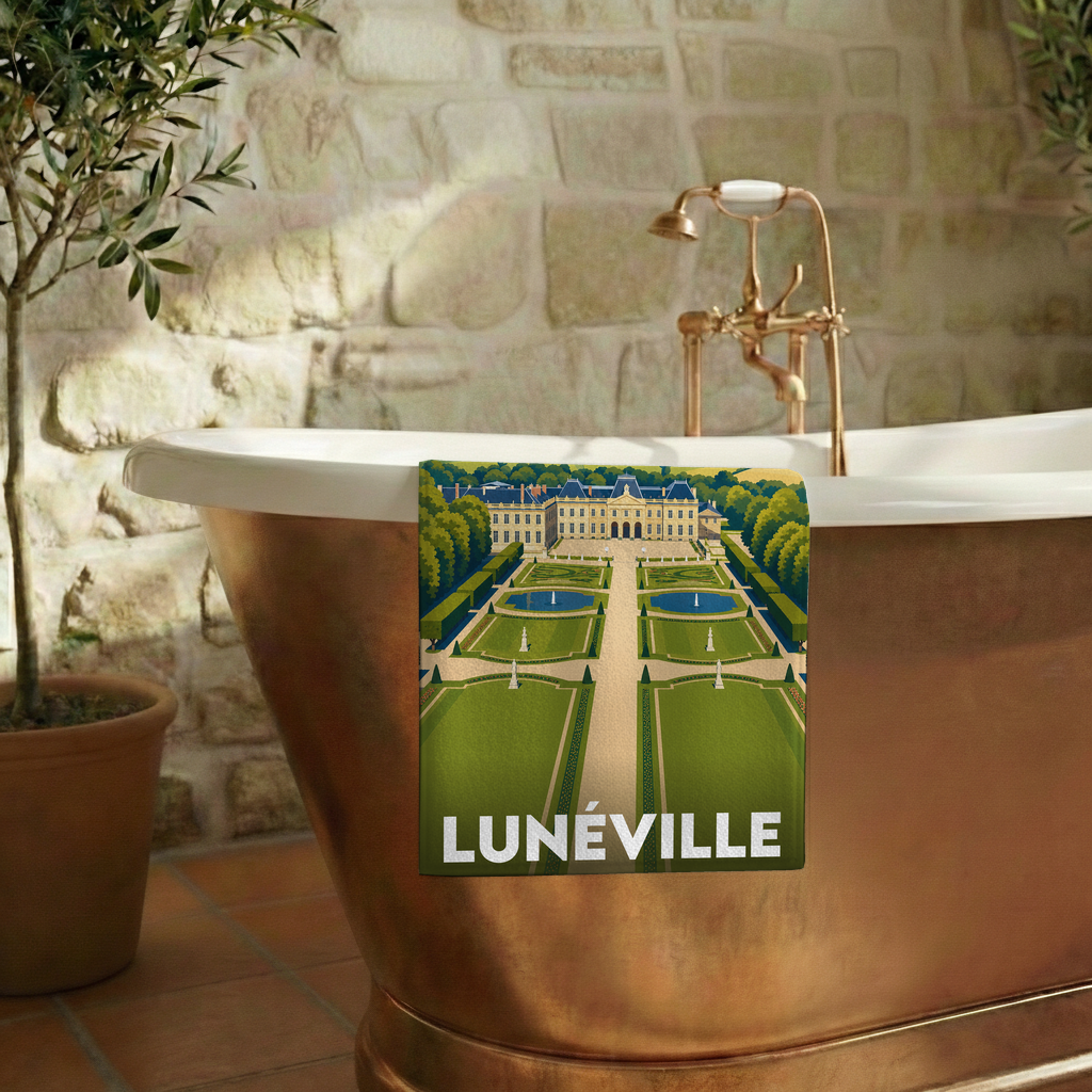Serviette de bain souvenir de la ville de Lunéville avec une illustration stylisée.