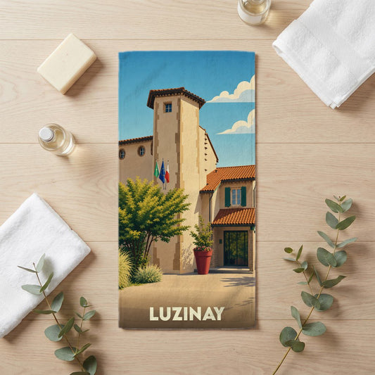 Serviette de bain souvenir de la ville de Luzinay avec une illustration stylisée.
