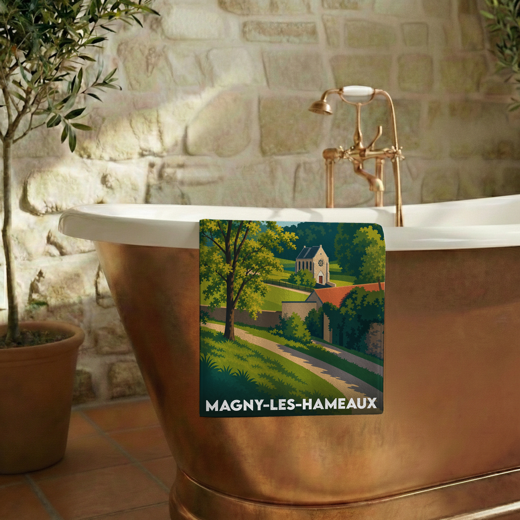 Serviette de bain souvenir de Magny-les-Hameaux avec une illustration de paysage champêtre.