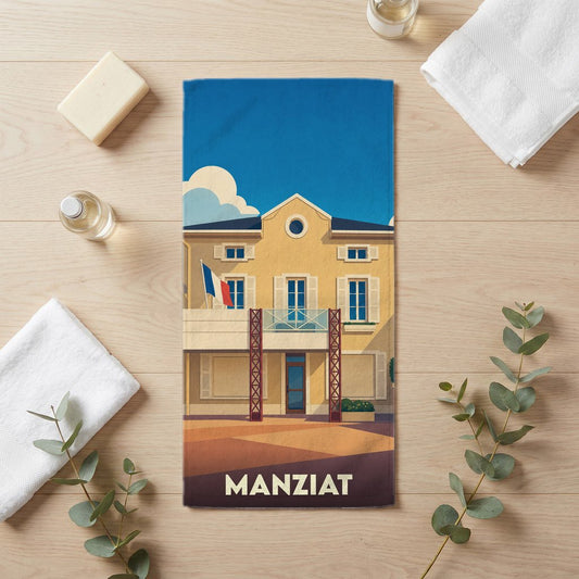 Serviette de bain souvenir de la ville de Manziat avec une illustration stylisée.