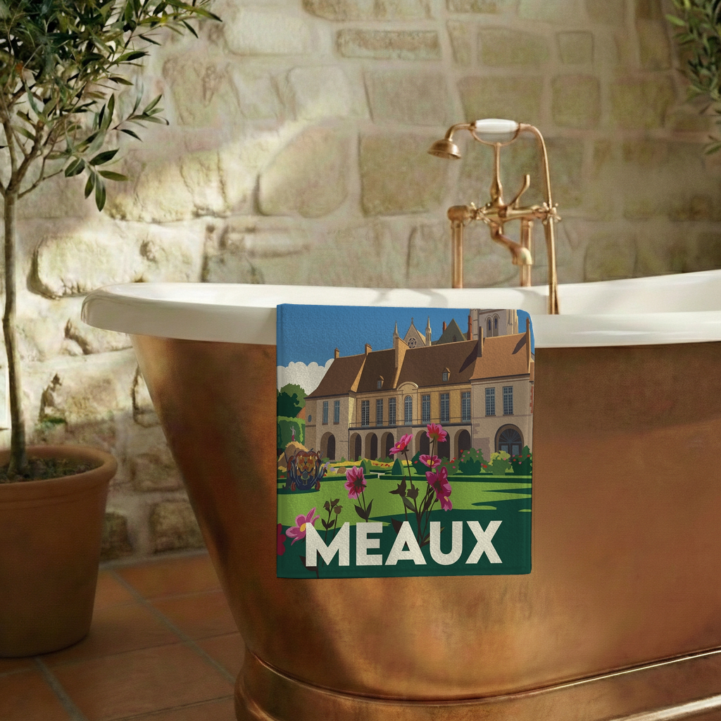 Serviette de bain souvenir de la ville de Meaux avec une illustration stylisée.