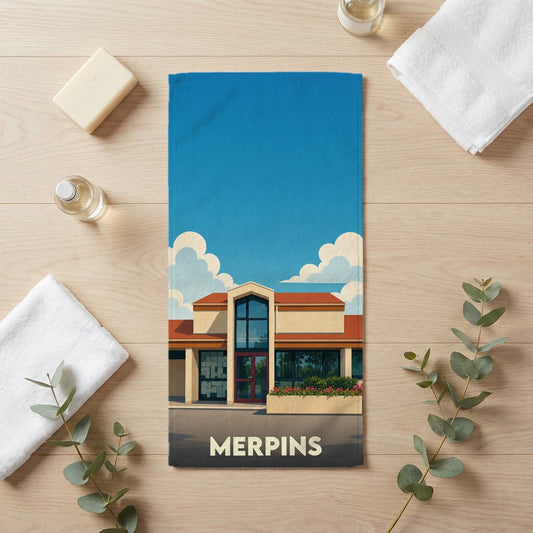 Serviette de bain souvenir de la ville de Merpins avec une illustration stylisée.