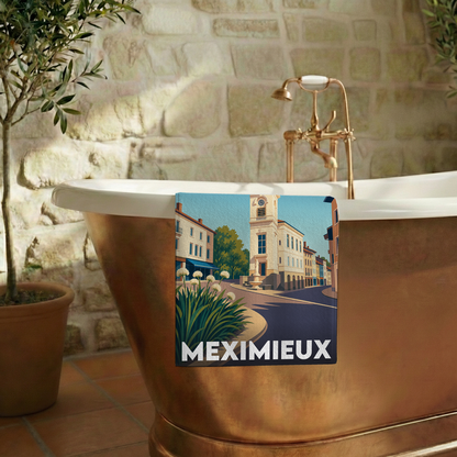 Serviette de bain souvenir de la ville de Meximieux avec une illustration stylisée.