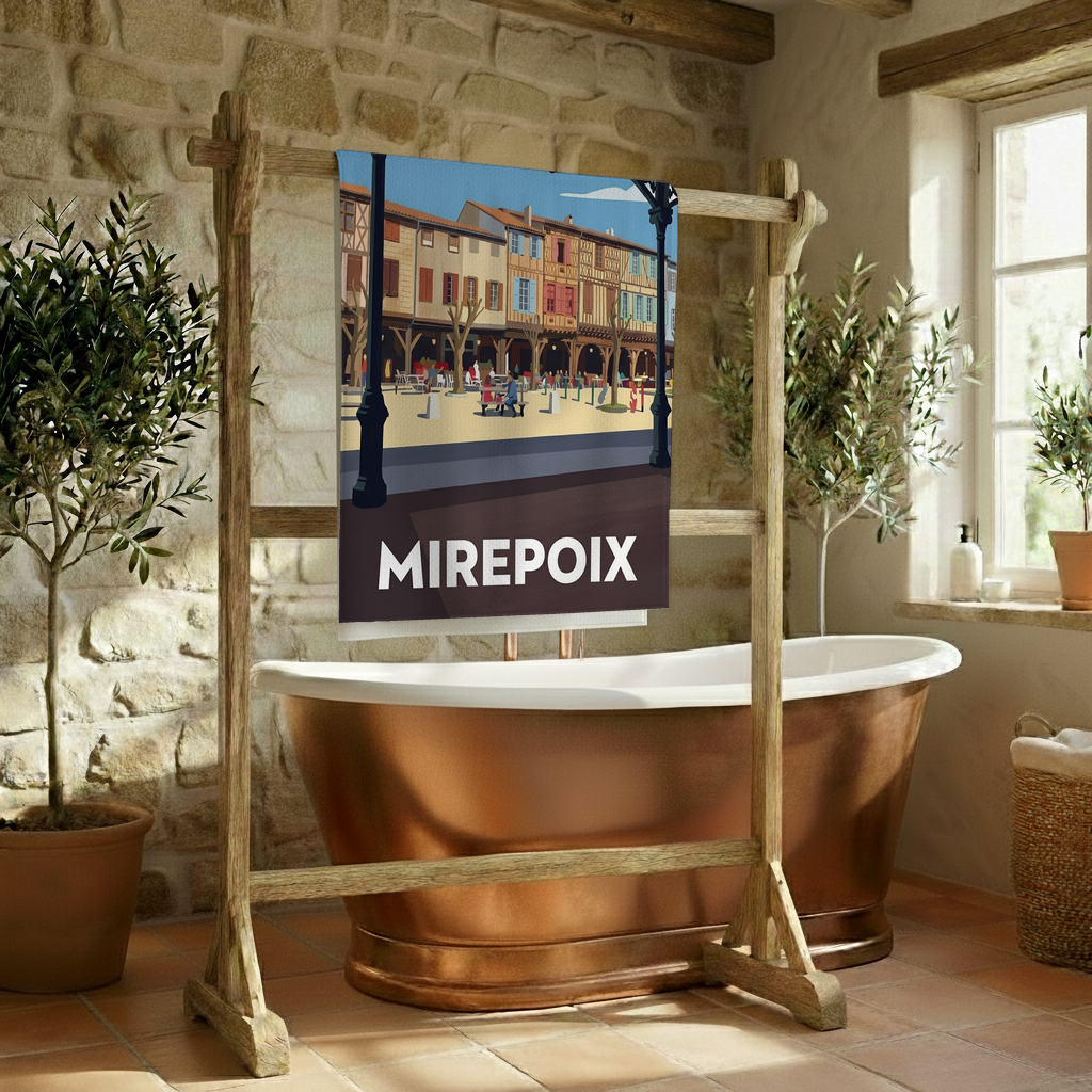 Serviette de bain souvenir de la ville de Mirepoix avec une illustration stylisée.
