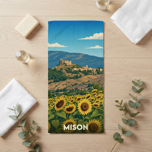 Serviette de bain souvenir de la ville de Mison avec une illustration stylisée d'un champ de tournesols.