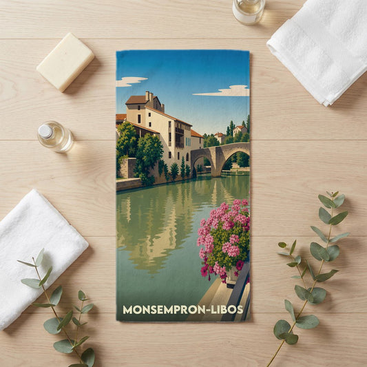 Serviette de bain souvenir de la ville de Monsempron-Libos avec une illustration stylisée.