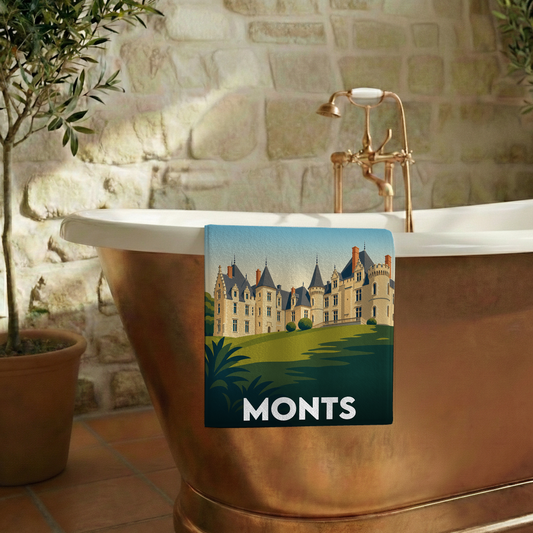 Serviette de bain souvenir de la ville de Monts avec une illustration stylisée d'un château.
