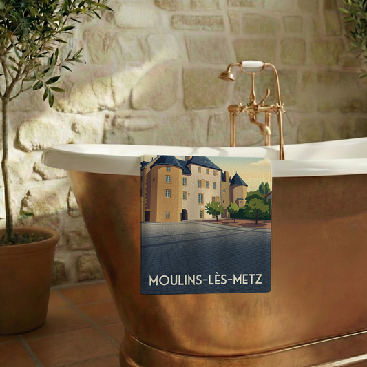 Serviette de bain souvenir de la ville de Moulins-lès-Metz avec une illustration stylisée.