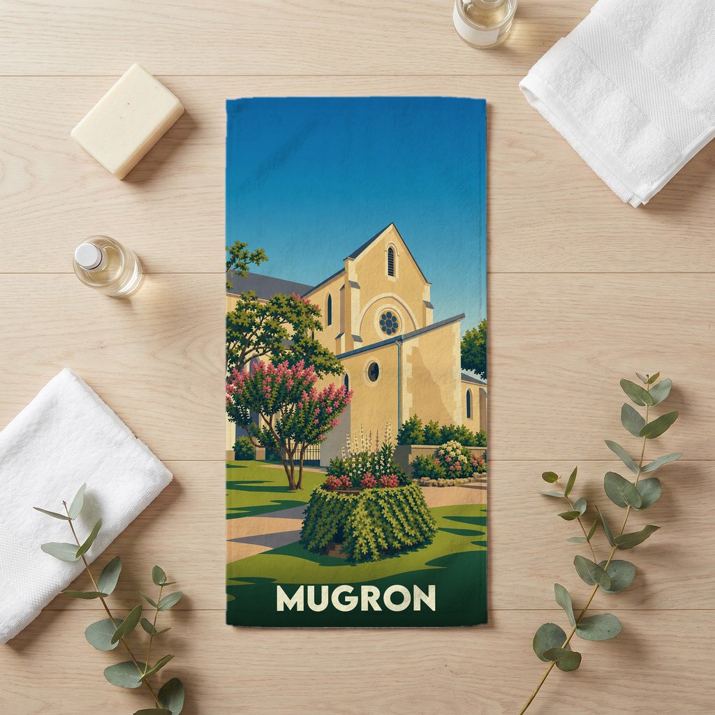 Serviette de bain souvenir de la ville de Mugron avec une illustration stylisée de son église.