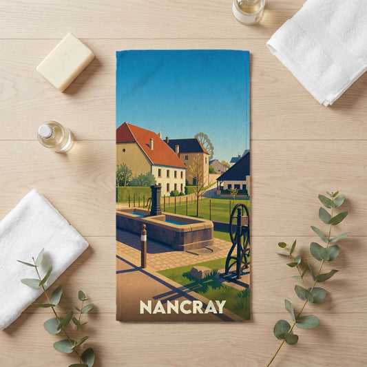 Serviette de bain souvenir de la ville de Nancray avec une illustration stylisée.