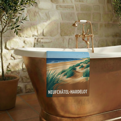 Serviette de bain souvenir de la ville de Neufchâtel-Hardelot avec une illustration stylisée.