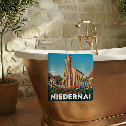 Serviette de bain souvenir de la ville de Niedernai avec une illustration stylisée.